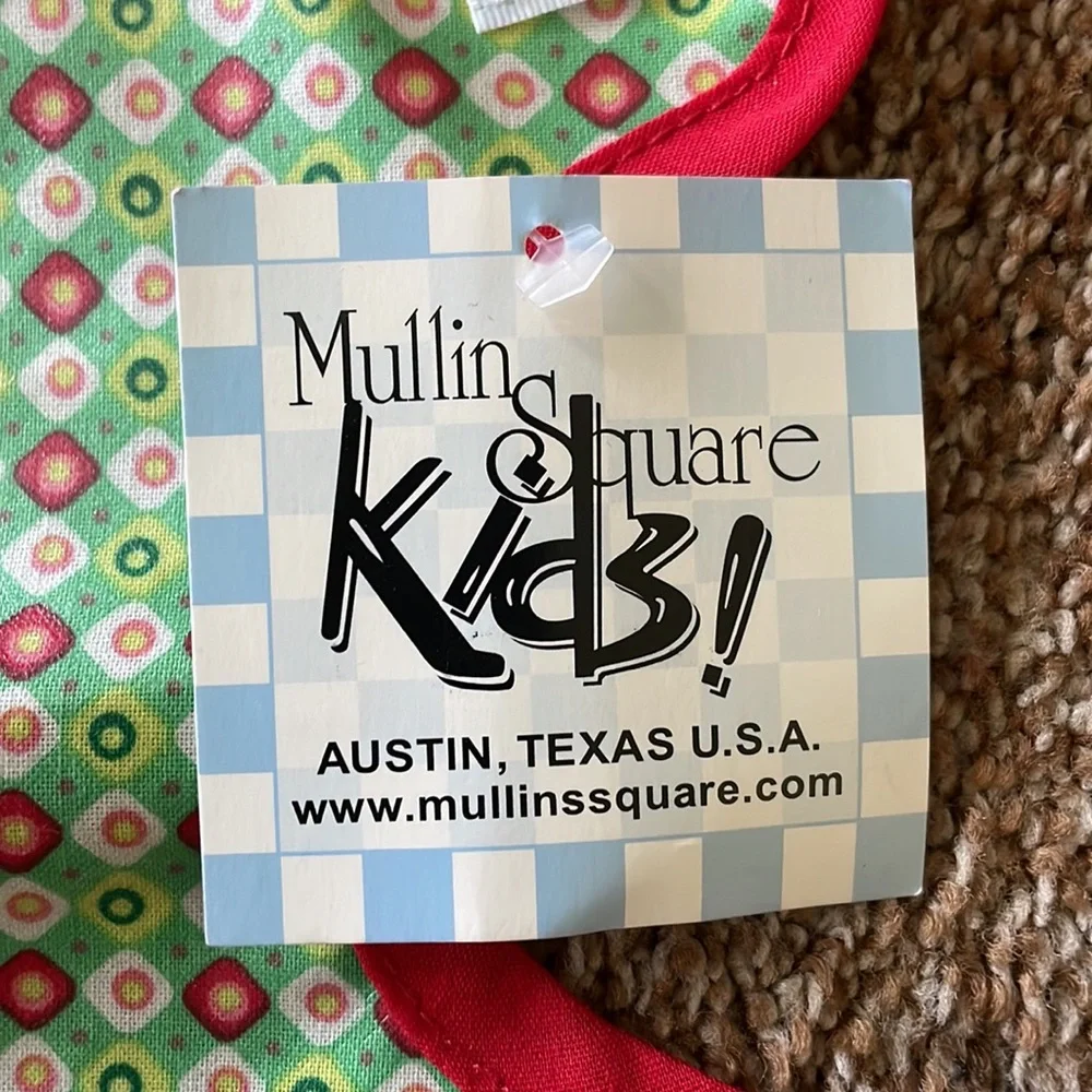 Baby bib with plastic coating on front